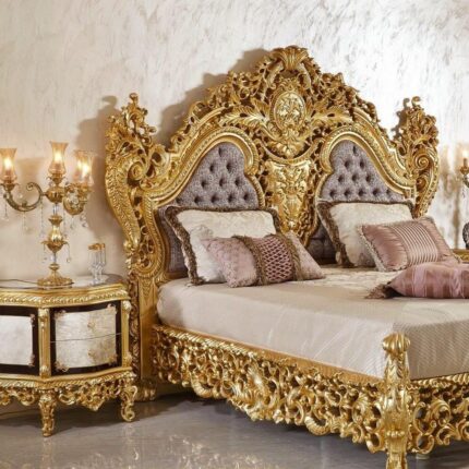Gold-Carved Bed with Tufted Gray Headboard and Ornate Candelabra Lamp in Baroque-Inspired Bedroom